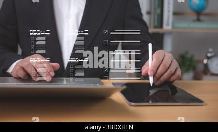 Digital audit in action as businessman reviews online forms and checklist, ensuring financial transparency, compliance, and efficient management throu Stock Photo