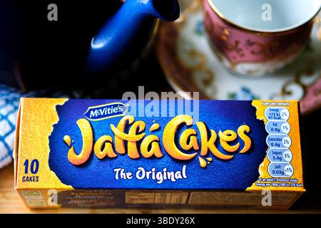 London uk, May 26 2025,  Chocolate Covered Orange Filled McVities Jaffa Cake Sponge Cakes or Biscuits Stock Photo