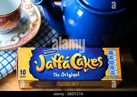 London uk, May 26 2025,  Chocolate Covered Orange Filled McVities Jaffa Cake Sponge Cakes or Biscuits Stock Photo