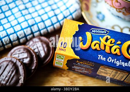 London uk, May 26 2025,  Chocolate Covered Orange Filled McVities Jaffa Cake Sponge Cakes or Biscuits Stock Photo