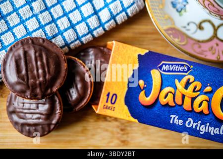 London uk, May 26 2025,  Chocolate Covered Orange Filled McVities Jaffa Cake Sponge Cakes or Biscuits Stock Photo