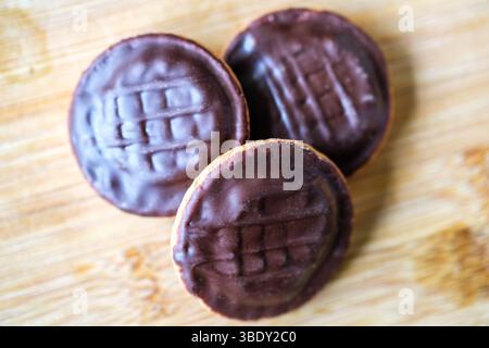 London uk, May 26 2025,  Chocolate Covered Orange Filled McVities Jaffa Cake Sponge Cakes or Biscuits Stock Photo
