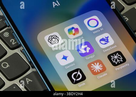 Assorted AI apps, including ChatGPT, Copilot, Meta AI, Gemini, Tongyi Qianwen (Qwen), DeepSeek, Grok, Claude, and Perplexity, are seen on an iPhone. Stock Photo
