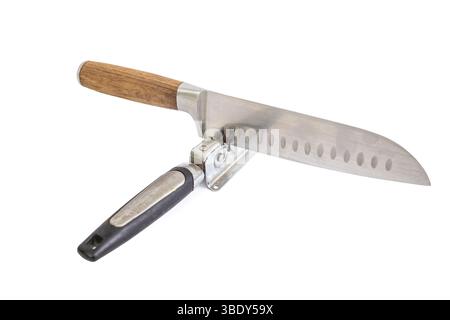 Vintage knife sharpener with a santoku chef knife, isolated on white Stock Photo