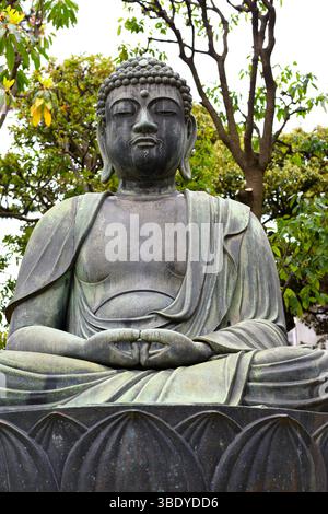 A large Buddha statue in the Sensoji temple complex in Asakusa