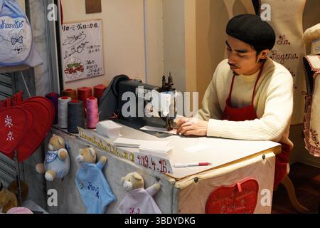 Tailor working on a sewing machine in the Asakusa district of Tokyo,Japan,Asia. Stock Photo