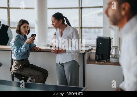 Multicultural business workers enjoying a break at the office Stock Photo