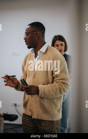 Multicultural business employees collaborating during office meeting Stock Photo