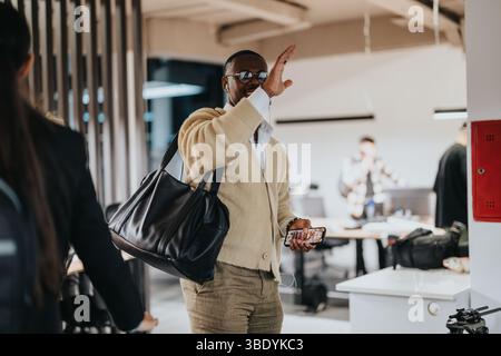 Casual greeting between colleagues in a modern office environment Stock Photo