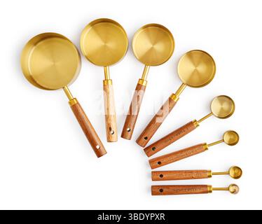 Golden measuring spoons with wooden handles isolated on white background Stock Photo