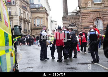 Police and emergency personnel dealing with a road traffic accident on Water Street near the Liver Building in Liverpool after a car collided with pedestrians during the Premier League winners parade. A man has been detained. Picture date: Monday May 26, 2025. Stock Photo