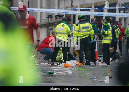 Police and emergency personnel dealing with a road traffic accident on Water Street near the Liver Building in Liverpool after a car collided with pedestrians during the Premier League winners parade. A man has been detained. Picture date: Monday May 26, 2025. Stock Photo