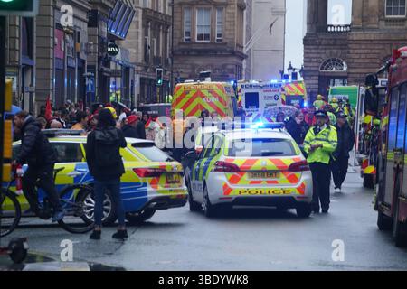 Police and emergency personnel dealing with a road traffic accident on Water Street near the Liver Building in Liverpool after a car collided with pedestrians during the Premier League winners parade. A man has been detained. Picture date: Monday May 26, 2025. Stock Photo