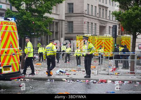 Police and emergency personnel dealing with a road traffic accident on Water Street near the Liver Building in Liverpool after a car collided with pedestrians during the Premier League winners parade. A man has been detained. Picture date: Monday May 26, 2025. Stock Photo