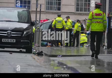 Police and emergency personnel dealing with a road traffic accident on Water Street near the Liver Building in Liverpool after a car collided with pedestrians during the Premier League winners parade. A man has been detained. Picture date: Monday May 26, 2025. Stock Photo
