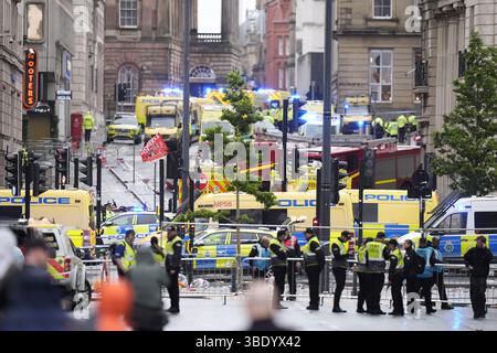 Police and emergency personnel dealing with a road traffic accident on Water Street near the Liver Building in Liverpool after a car collided with pedestrians during the Premier League winners parade. A man has been detained. Picture date: Monday May 26, 2025. Stock Photo