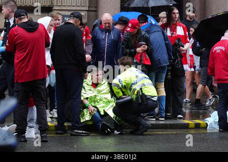 Police and emergency personnel dealing with a road traffic accident on Water Street near the Liver Building in Liverpool after a car collided with pedestrians during the Premier League winners parade. A man has been detained. Picture date: Monday May 26, 2025. Stock Photo