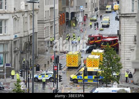 Police and emergency personnel dealing with a road traffic accident on Water Street near the Liver Building in Liverpool after a car collided with pedestrians during the Premier League winners parade. A man has been detained. Picture date: Monday May 26, 2025. Stock Photo
