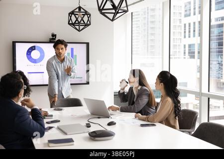 Latino business coach or executive manager makes speech during meeting Stock Photo