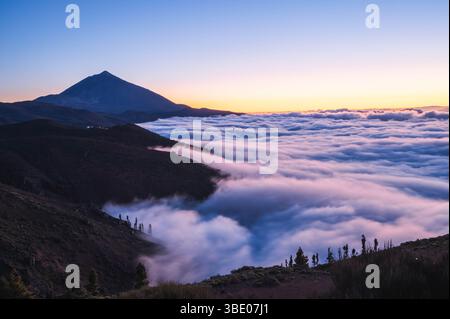Stunning sunset above the clouds in the Teide volcano national park, Tenerife, Canary Islands, Spain Stock Photo