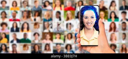 A person holds a smartphone displaying a facial recognition scan Stock Photo