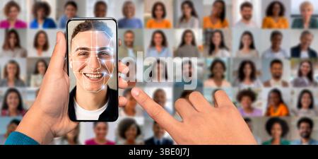 A person holds a smartphone displaying face recognition technology Stock Photo