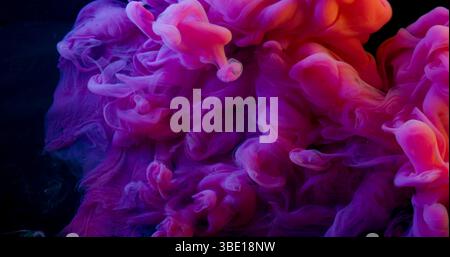 Steam flow. Colorful fog. Bright purple cloud swirl spilling in art black background. Acid ink drop mix haze glow defocused liquid. Stock Photo