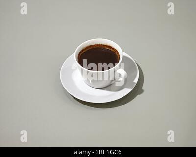 A cup of black coffee over gray background Stock Photo