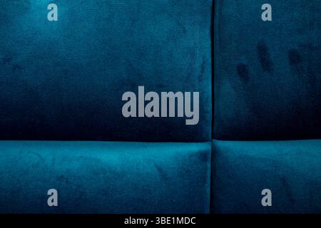 A close-up of rich blue upholstery shows texture and patterns, showcasing soft fibers and subtle variations in color. Ideal for design inspiration and Stock Photo