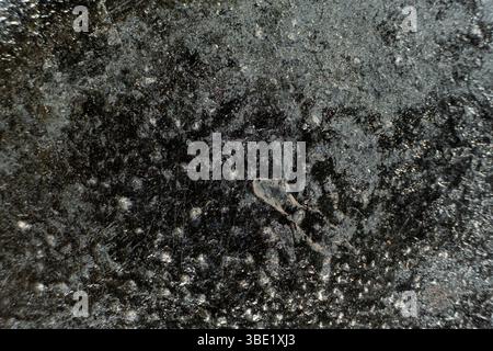 Rust stains on cast iron surface, macro Stock Photo