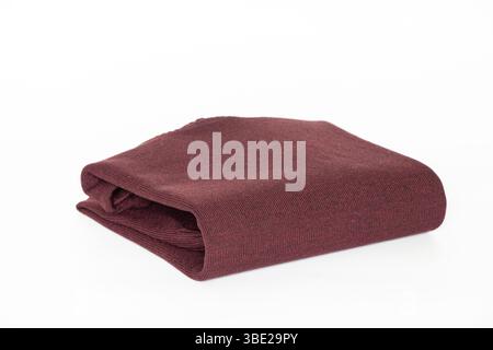 Folded burgundy men's turtleneck sweater on a white background, clothing for a catalog or online store Stock Photo