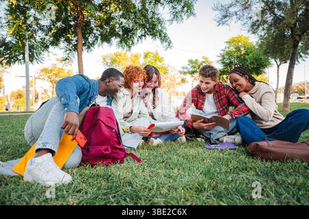 Dynamic group of enthusiastic students sharing ideas and collaborating on their studies in an outdoor setting, fostering friendship and teamwork while Stock Photo