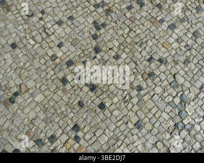Natural Stone Mosaic Pavement in Grey, anthracite and white. Space for texts and designs. Stock Photo