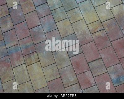 Rectangular paving stones with autumn tones on new harbor promenade. Space for texts and designs. Copyspace Stock Photo