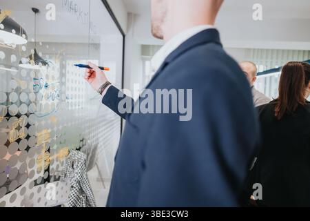 Business colleagues collaborating on a strategy during a meeting Stock Photo