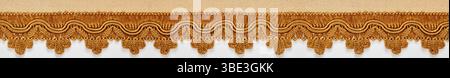 silk trimmings for furniture, ochre color, classic style on white background Stock Photo