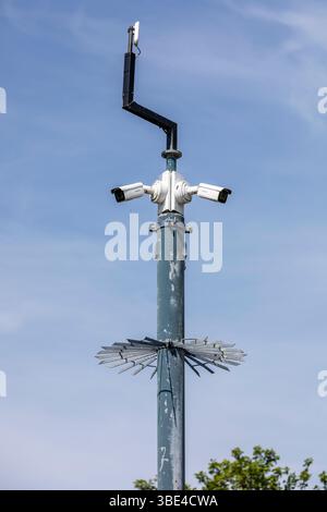 CCTV cameras on top of a high pole Stock Photo
