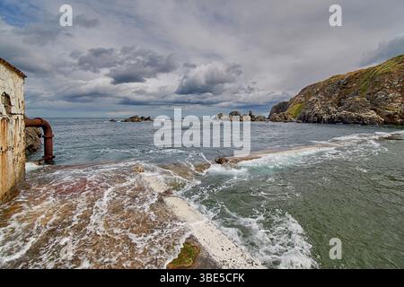 Macduff Aberdeenshire Scotland Tarlair open air swimming pool the outer pool filling with sea water at high tide Stock Photo