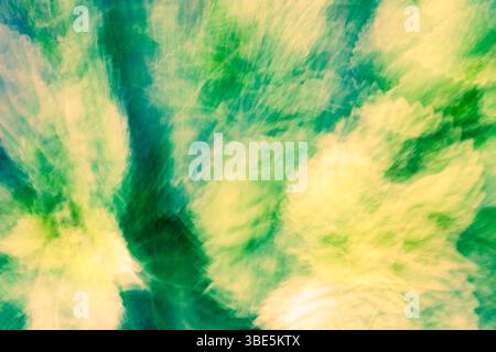 A vibrant abstract background with dynamic green and yellow hues. Captures motion blur, creating a dreamy and energetic visual effect, perfect for cre Stock Photo