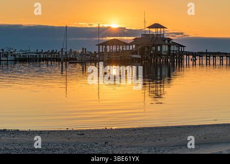 Biloxi Schooner Pier Complex at sunset on the Gulf of Mexico at Biloxi, Mississippi, USA Stock Photo