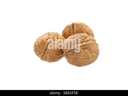 Walnut isolated. Three unpeeled walnuts nut on white background,  with clipping path. Stock Photo