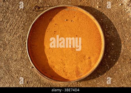 Rust on a metal flat dish. Natural oxidation. Stock Photo