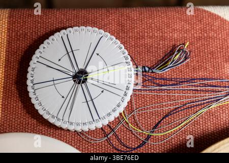 Kumihimo Braiding Disk with Colorful Threads for Crafting Stock Photo