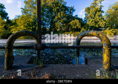 Rusted Canal Access Railings at Lützowufer, Berlin, on a Spring Afternoon. Stock Photo