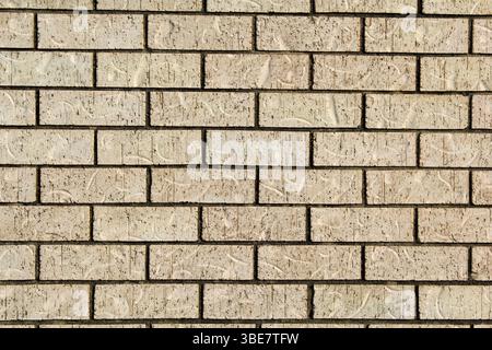 Light beige brick wall abstract textured background Stock Photo