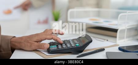 Business team calculate benefit, working woman, spreadsheets, graph financial development, bank accounts, statistics, economy, data analysis, investme Stock Photo