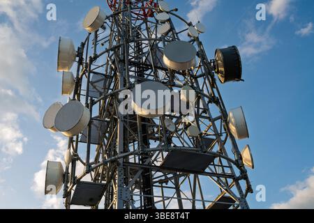 Mobile network and satellite communications mast on top of mountainous island Stock Photo