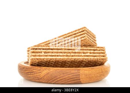 Sweet waffles on a wooden saucer, close-up, isolated on a white background. Stock Photo