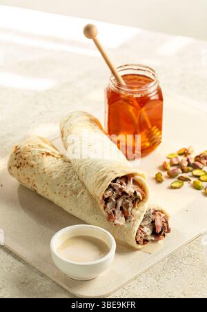 Sweet and Savory Lamb Shawarma in Saj Bread with Honey Stock Photo