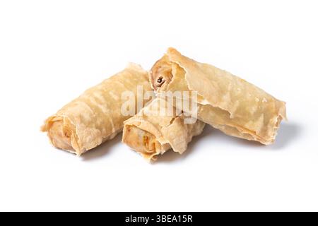 Crispy vegetables spring Rolls on Ceramic Plate isolated on white background Stock Photo